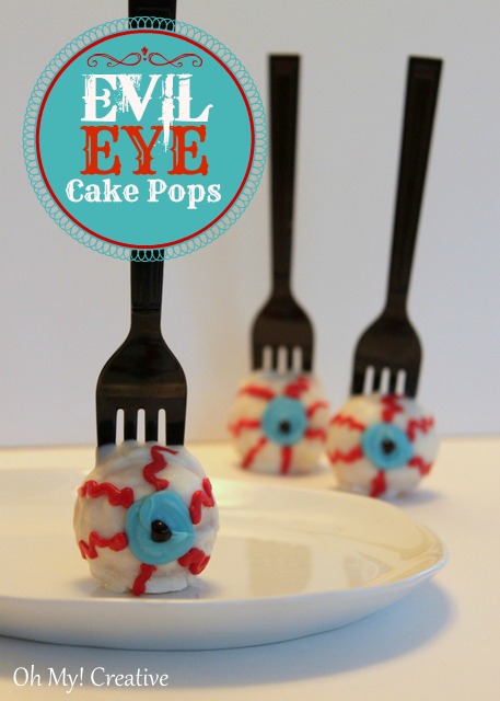 Fun evil eye cake pops perfect for Halloween! Create a unique detail by using a fork instead of a pop stick!  OHMY-CREATIVE.COM