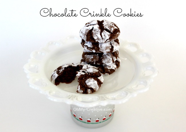 Their soft chewy texture along with a dusting of powdered sugar make these Chocolate Crinkle Cookies a perfect holiday sweet! Yum! | OHMY-CREATIVE.COM
