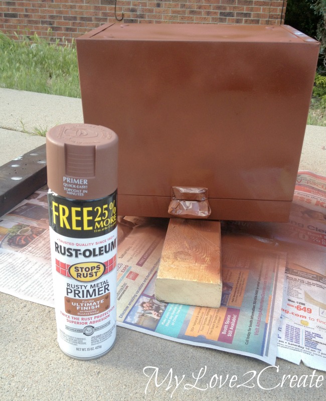 spray painting metal box with primer