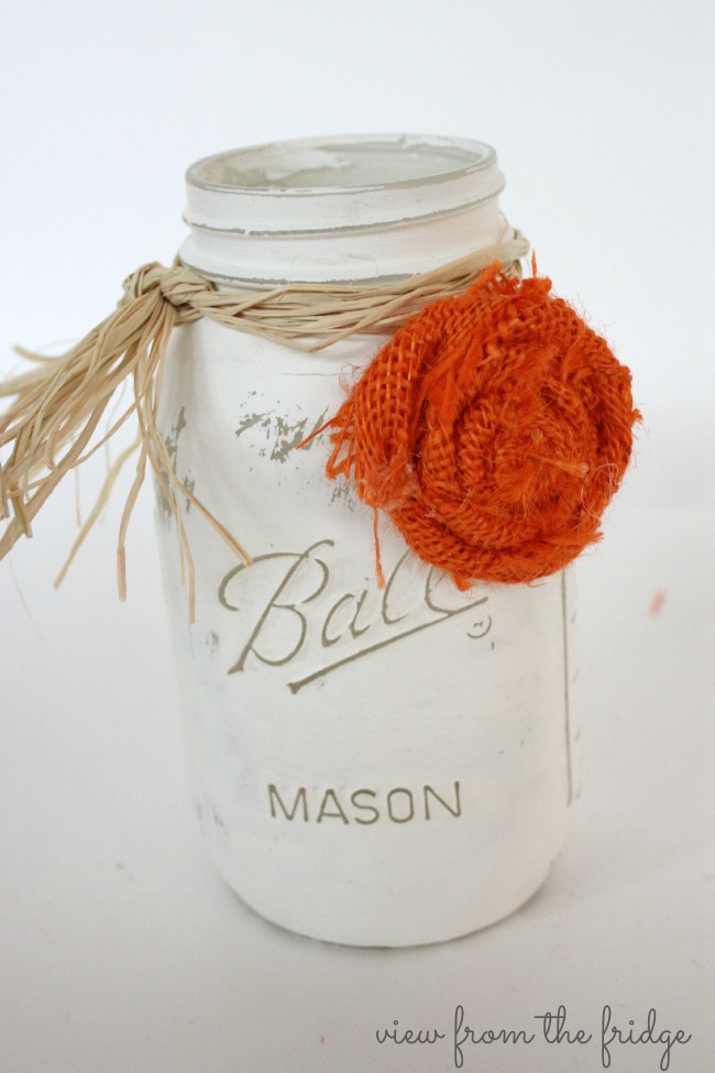 This Easy Fall DIY Centerpiece is a perfect Fall decor accent for the home. OHMY-CREATIVE.COM | Fall Decor | Mason Jar Centerpiece | Fall Mason Jar Craft | Fall Decorating | Painted Mason Jars | How to make a rosette | Wheat Fall decor | How to decorate for Fall | Crate Decor | Fall Mason Jar Decor | Fall Home Decor | Mason Jar Centerpieces