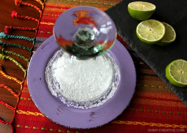 margarita glass on a purple plate with salt. 
