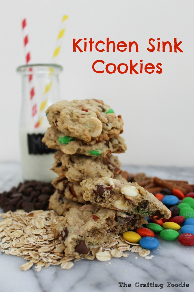 These chewy, soft Kitchen Sink Cookies are filled with chocolate chips, white chocolate, oatmeal, M&M's and one unique add-in that gives these cookies a salty, crunch. The Crafting Foodie for OHMY-CREATIVE.COM