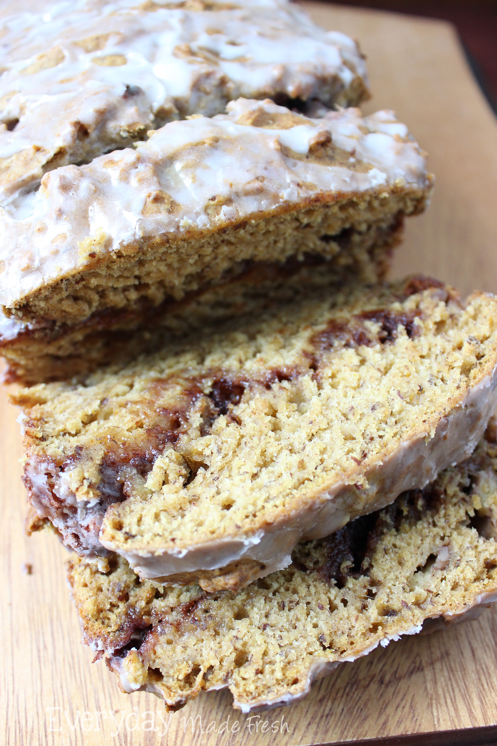 This banana bread is ready for fall with pumpkin swirled with a cinnamon mixture. Slice and serve warm just like it is here!