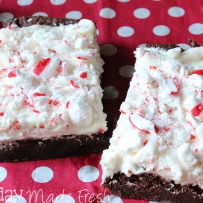 These Peppermint Frosted Brownies are made from a simple homemade mix, and topped with a cream cheese peppermint frosting that make them delectable! EverydayMadeFresh.com for OHMY-CREATIVE.COM