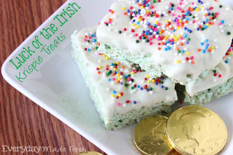 These Luck of the Irish Rice Krispie Treats are festive green and dipped in white chocolate with rainbow sprinkles! | OHMY-CREATIVE.COM via EverydayMadeFresh.com