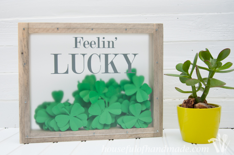 Make a beautiful shadow box full of clovers for a fun St. Patrick's Day shadow box decor idea. See if you can find the one 4 leaf clover in the bunch. | OhMy-Creative.com