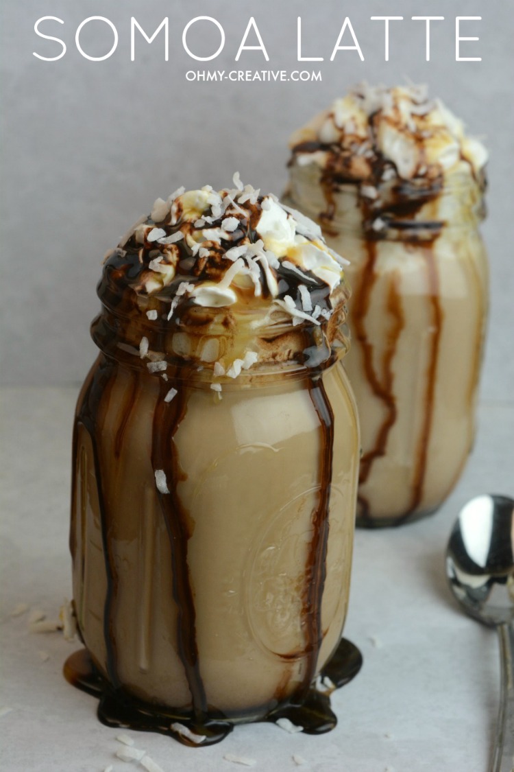 While you can only buy Girl Scout Cookies once a year you can make this amazing Somoa Latte any time! Dripping with caramel and chocolate sauces topped with whipped cream and toasted coconut, this Somoa Latte will be hard to resist! | OHMY-CREATIVE.COM
