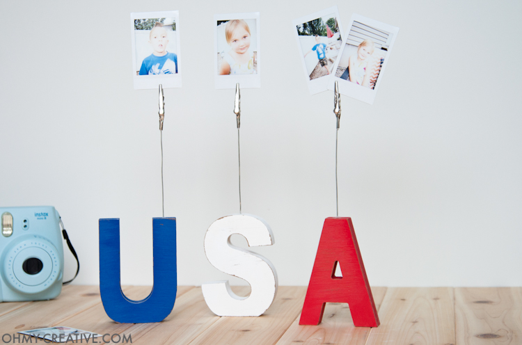 This super easy craft is the perfect addition to your patriotic decor. Make these USA sign displays to hold pictures or even food labels for your 4th of July barbecue. | OHMY-CREATIVE.COM
