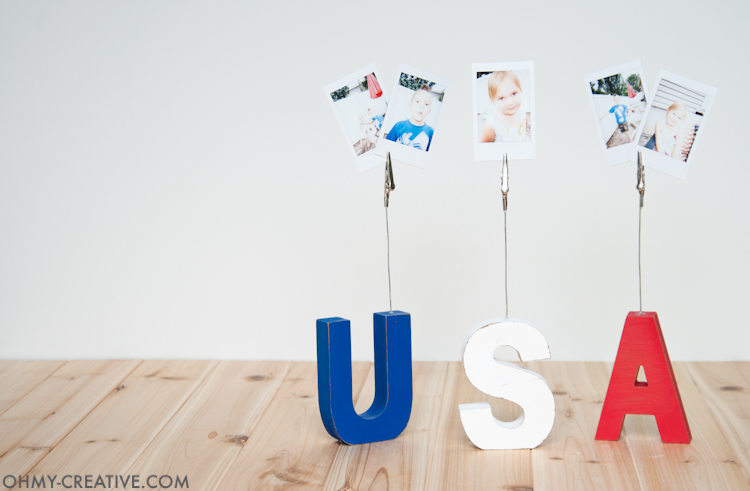 This super easy craft is the perfect addition to your patriotic decor. Make these USA sign displays to hold pictures or even food labels for your 4th of July barbecue. | OHMY-CREATIVE.COM