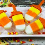 Yogurt Candy Corn Pops! Yellow, orange and white - those infinite colors are a sure sign that Fall and Halloween are on the way! An easy to make Homemade popsicle Recipe that is fun to eat. What a great Halloween kids treat! Popular pins by OHMY-CREATIVE.COM
