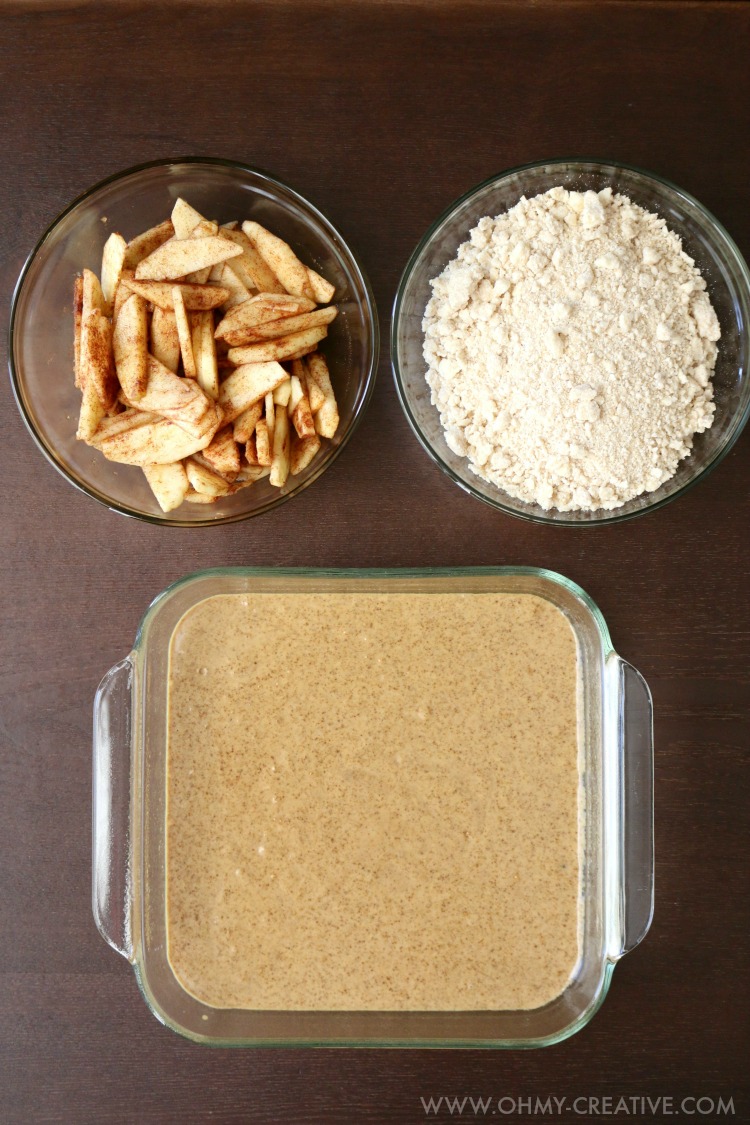The ingredients for the cake - cinnamon dusted apples, cake mix, and a crumb topping 