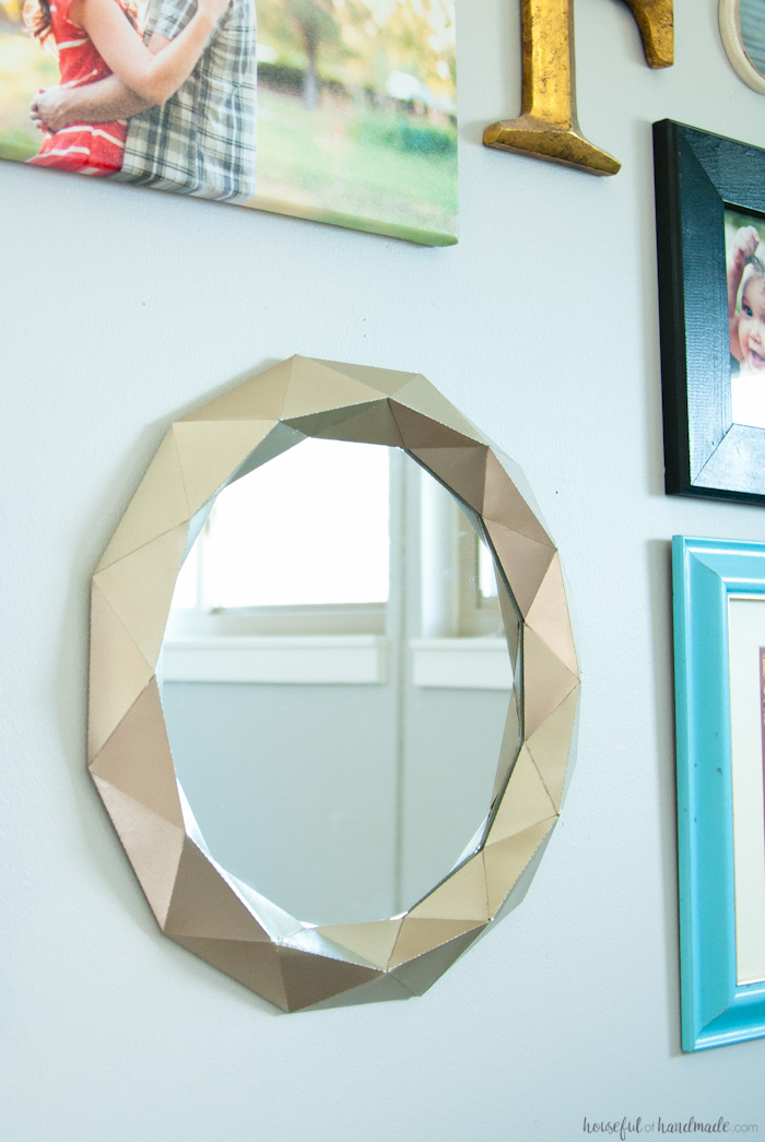 This beautiful Anthropologie knock-off mirror only cost $10 to make! You'll never guess what it is made out of. | Housefulofhandmade.com
