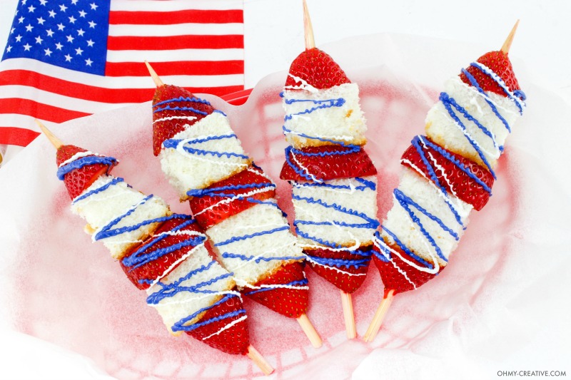 These Strawberry Shortcake Dessert Kabobs are delicious all summer long! | OHMY-CREATIVE.COM | strawberry shortcake recipe | strawberry shortcake skewers | fruit kabobs | fruit skewers | red white and blue | patriotic dessert | how to make kabobs | summer dessert | 4th of july dessert | fourth of july dessert | angel food cake | strawberries | dessert 