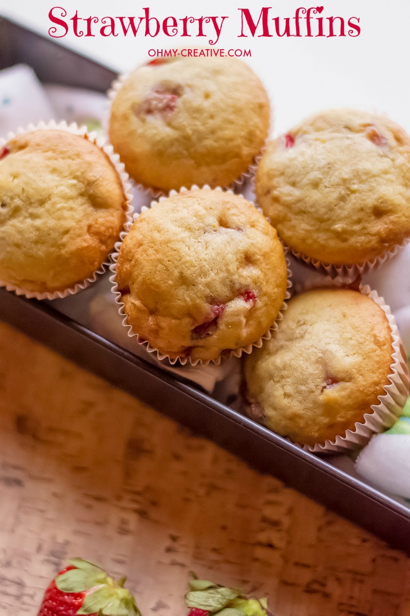 These Strawberry Muffins are made with Fresh Strawberries - an easy out the door breakfast muffin or snack! OHMY-CREATIVE.COM | Strawberry Muffins | Strawberry Muffin Recipe | Breakfast food | Snack Recipe | Muffin Recipe | Strawberry Banana Muffins #strawberrymuffins #muffinrecipe #breakfast #breakfastrecipe #muffins