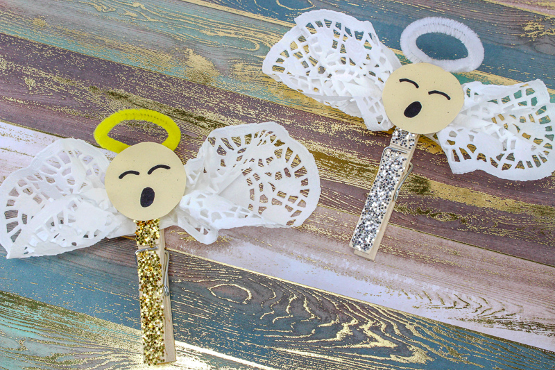 These Easy Clothespin Doily Angel Crafts for Kids make great DIY ornaments for young children. A great Christmas craft the kids can hang on the tree every year! OHMY-CREATIVE.COM #diychristmasornament #christmascraft #kidscraft #christmas #angel #angelcraft 
