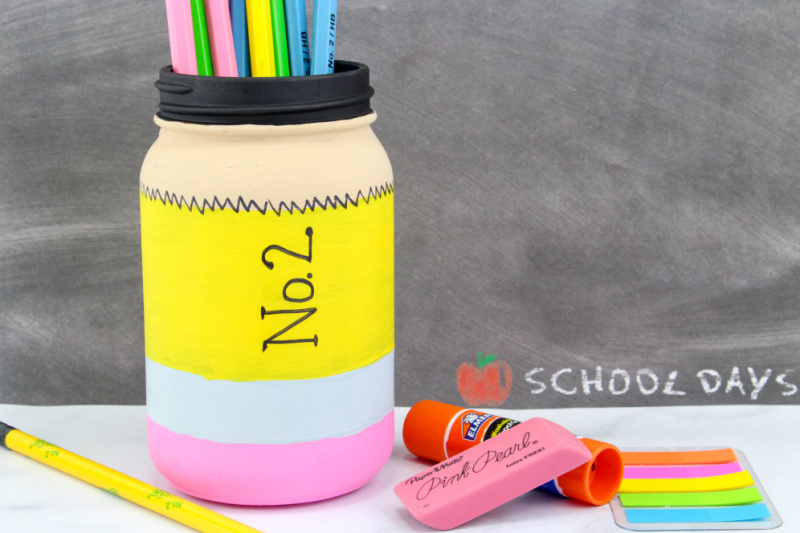 finished pencil mason jar with pencils and other school supplies
