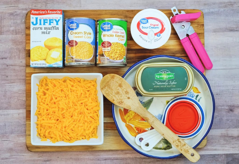 Displayed are all the ingredients to make a Jiffy Corn Casserole side dish.