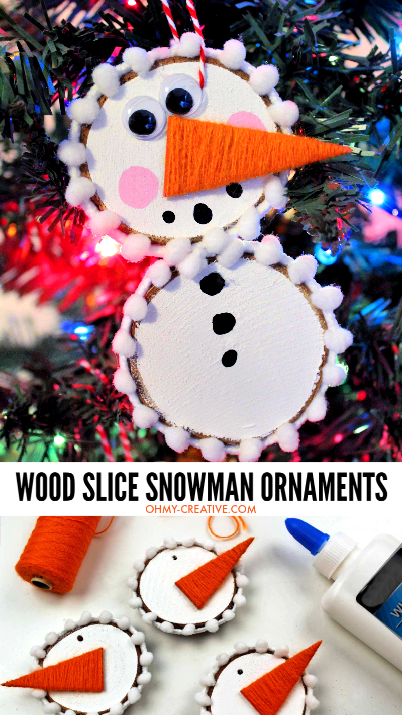 finished wood slice snowman ornament on a Christmas tree with colored lights
