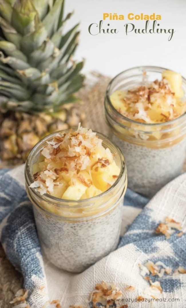 This pina colada pudding is heavenly. It tastes amazing any time of the day. These two pina colada chia puddings are displayed next to a whole pineapple! 