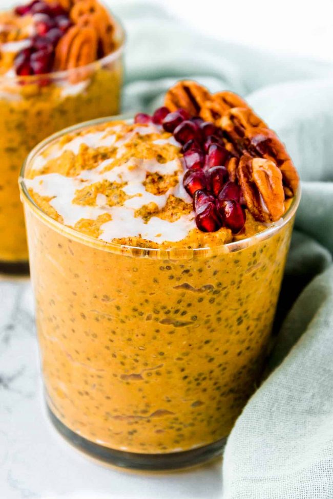 Pumpkin pie chia pudding sitting on a white background.