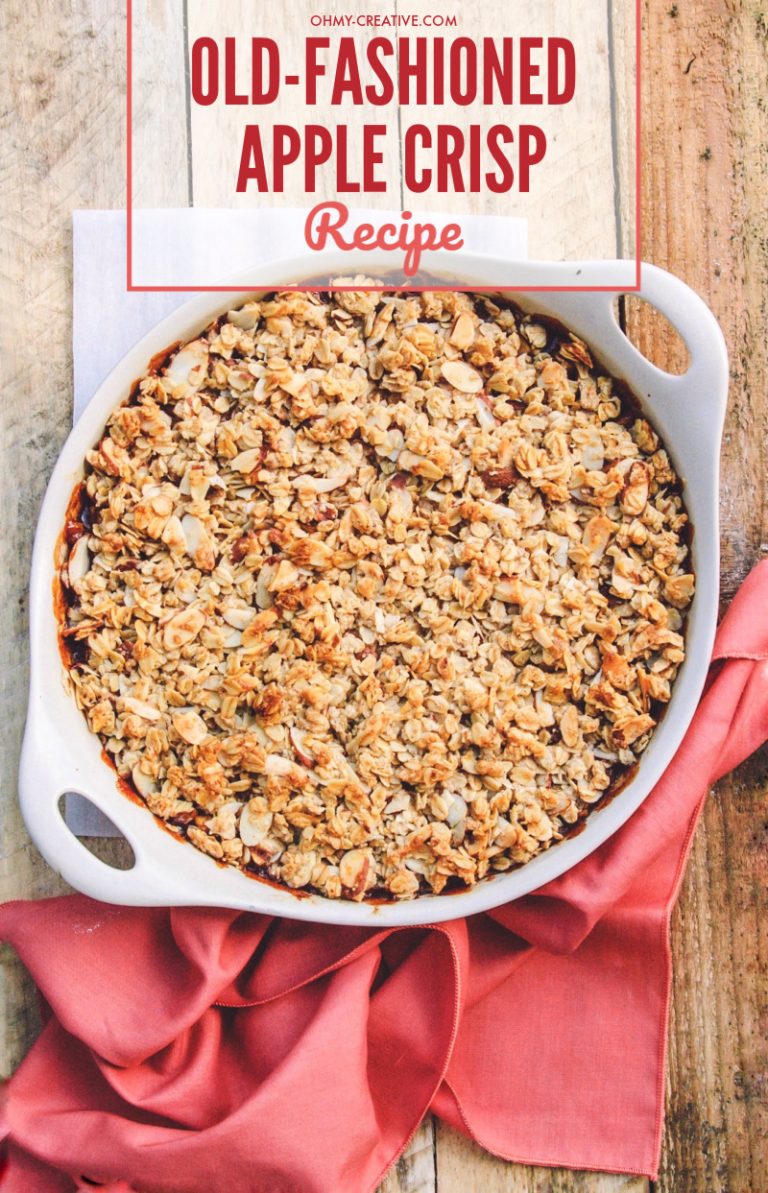 This apple crisp is served in a white dish adorn with a amber napkin.