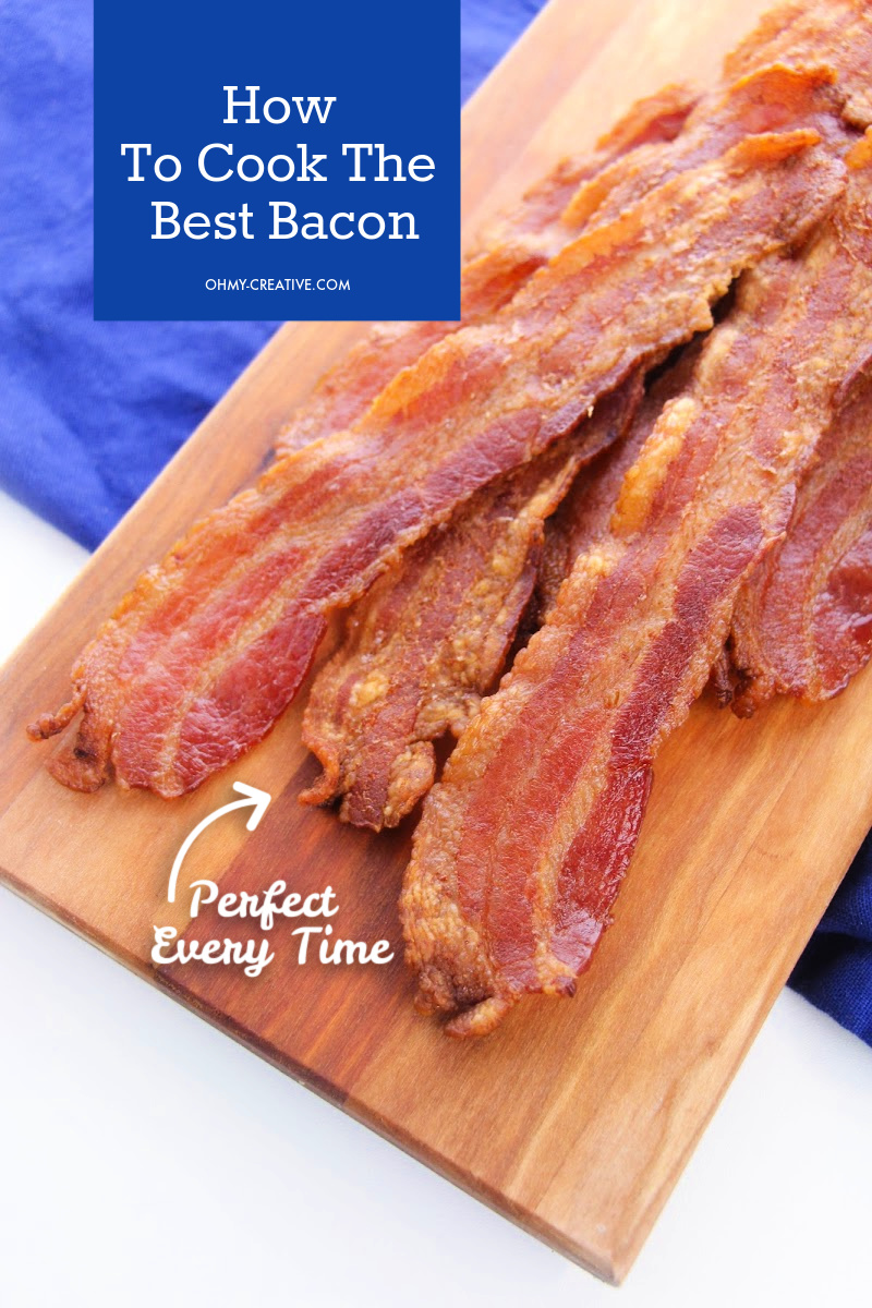Perfect baked bacon from the oven on a cutting board.