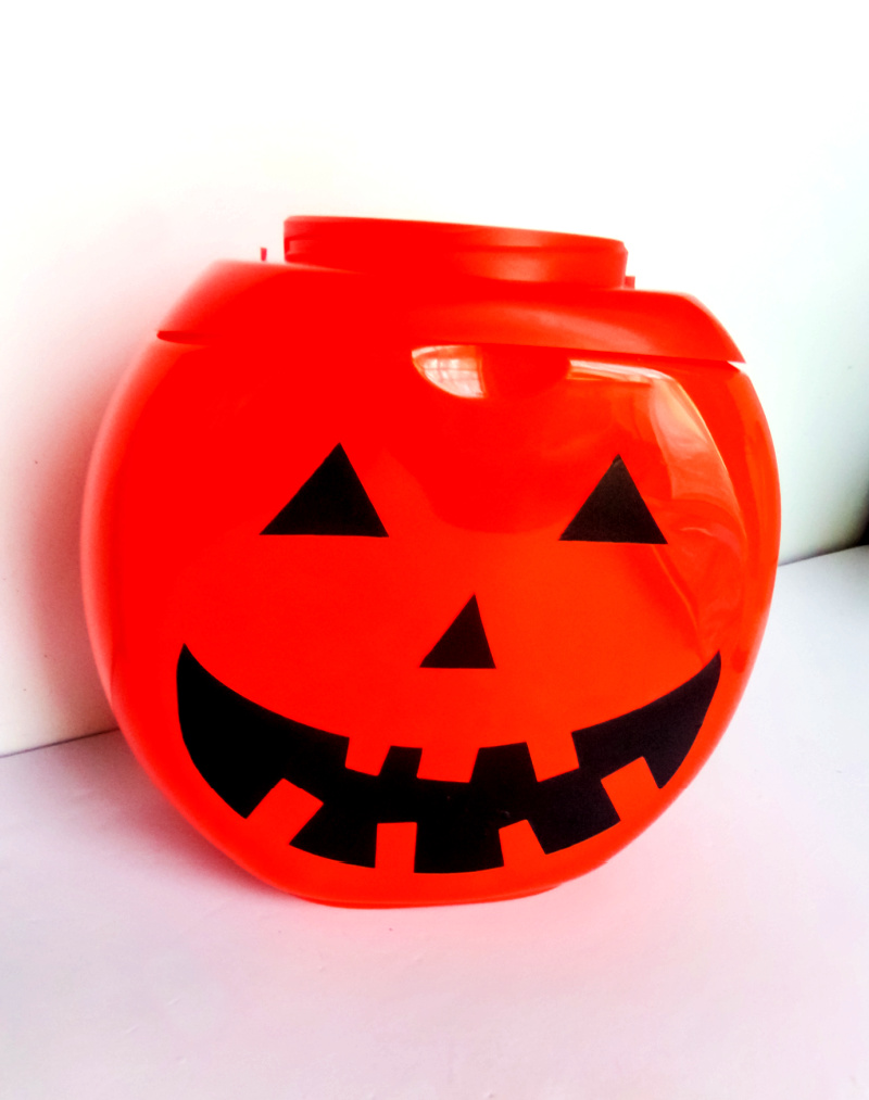 Finished DIY pumpkin from a Tide pod container.