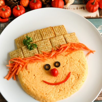 If you are looking for a really fun appetizer for Thanksgiving or another fall party, then this one is perfect! Everything on this adorable scarecrow is edible, but he's so cute you won't want to eat it!