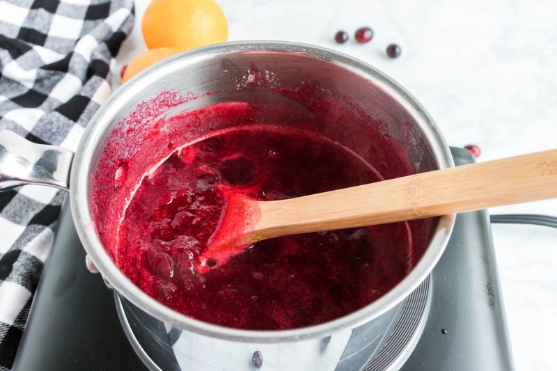 Stir with a whisk or wooden spoon until the cranberries have split open and the sauce only has a few small lumps. This takes around 15-20 minutes. Stir frequently so they don’t burn to the pan.