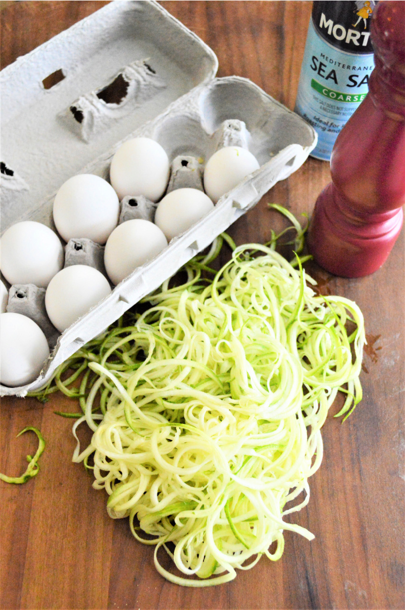 zucchini egg nest ingredients: a dozen eggs and freshly spiralized zucchini. 
