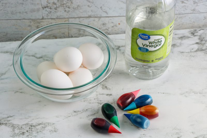 Supplies for how to dye Easter eggs with food coloring.