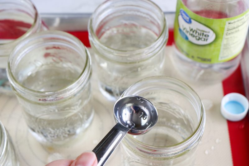 To each container, carefully add 1 to 1 ½ cups boiling water. Stir vinegar into each jar/glass.