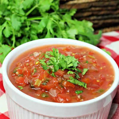 This easy homemade salsa recipe is served in a white bowl and is ready to serve with chips!