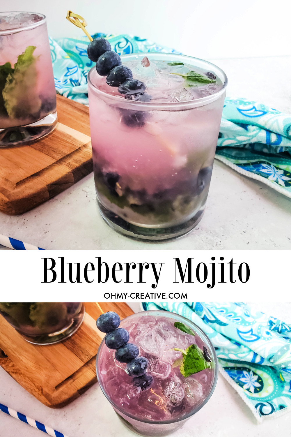 A blueberry mojito cocktail garnished with a skewer of blueberries and surrounded by a aqua hand towel and blue striped straw