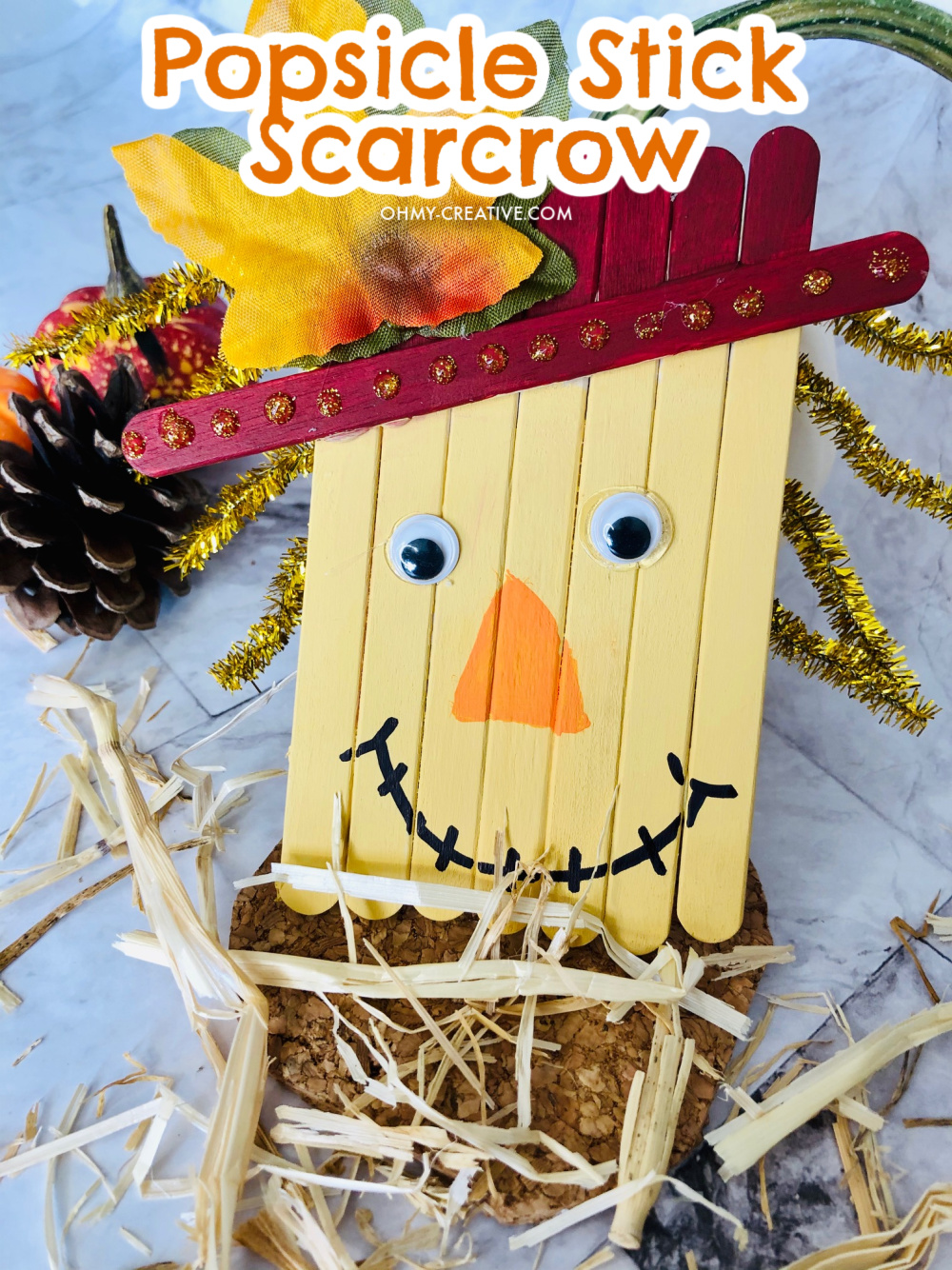 A cute and fun scarecrow fall craft made out of craft sticks 