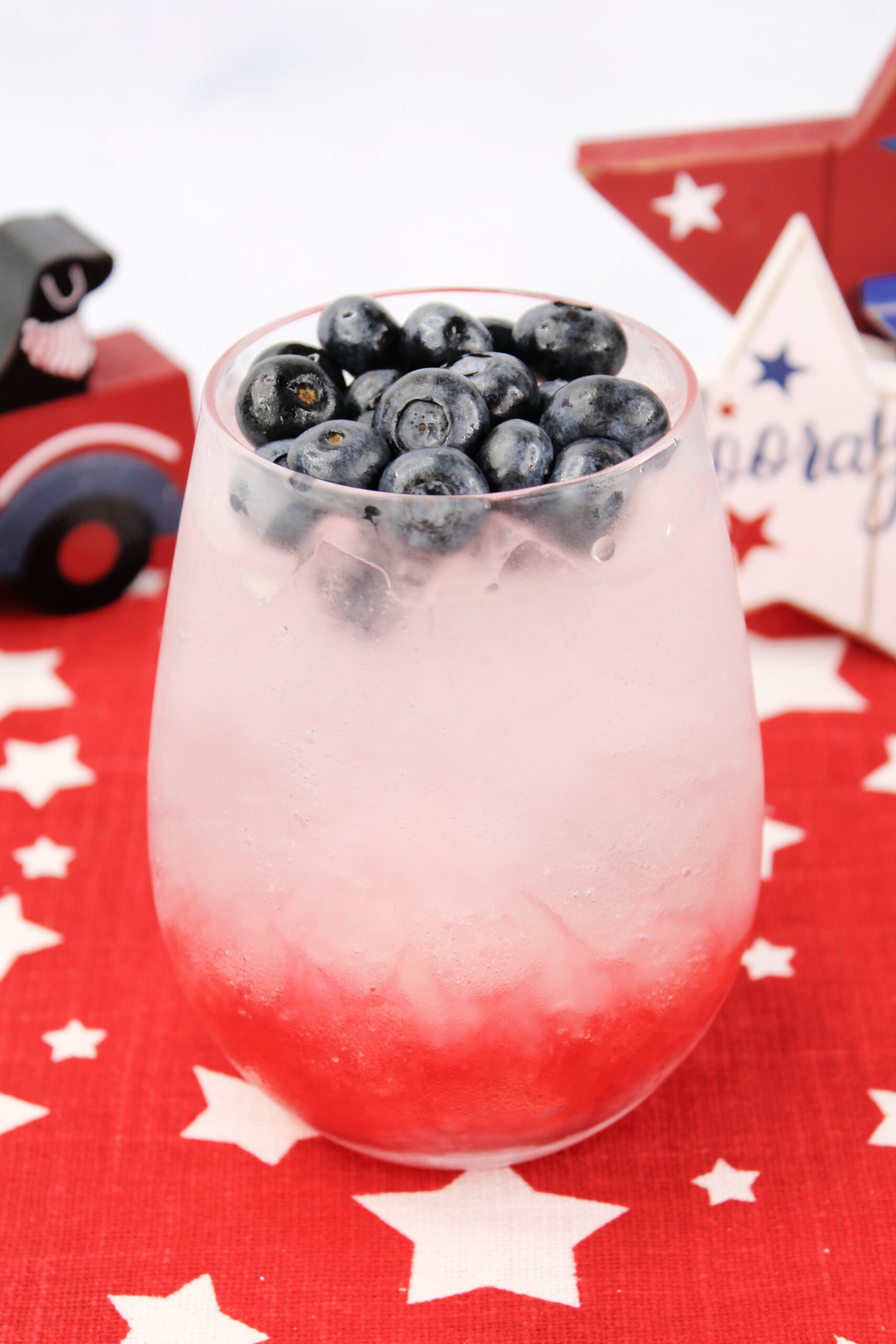 Top the patriotic mojito with blueberries before garnishing with a watermelon star.