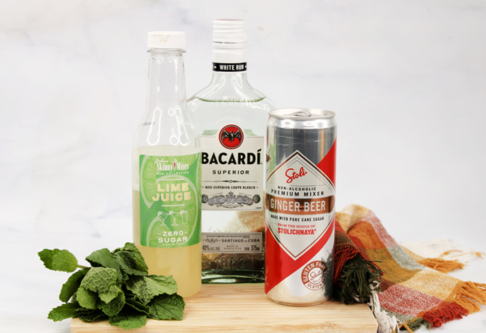 Everything you need to make a moscow mule mojito; light rum, ginger beer, lime juice and mint.