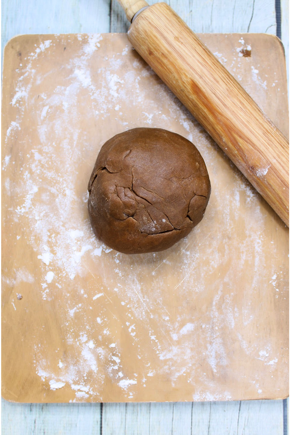 Place the dough ball on a lightly floured counter. Roll out the gingerbread dough to 1⁄2 inch thick.