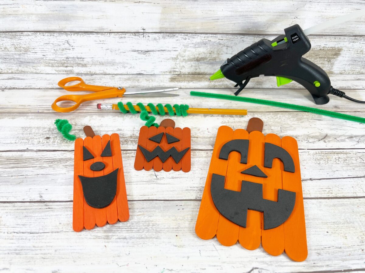 Attach stems to the popsicle pumpkins