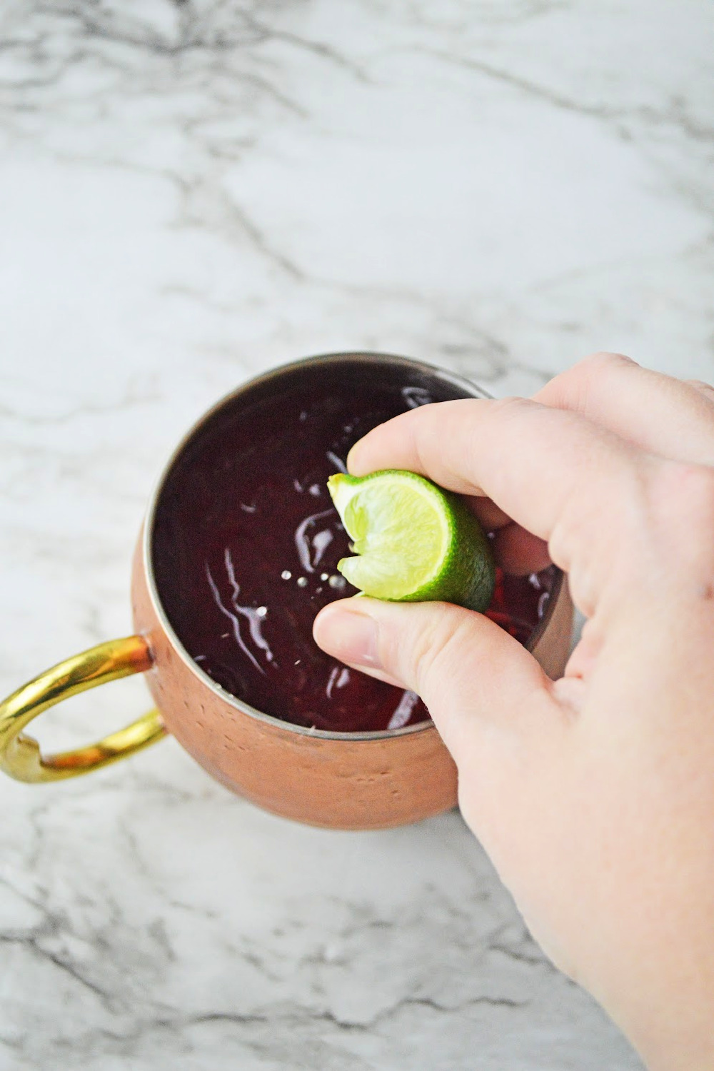 Add fresh lime juice to a cranberry Moscow mule.