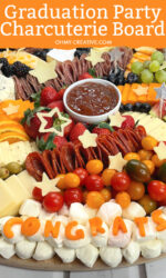 graduation party charcuterie board with the congrats made out of cheeses.