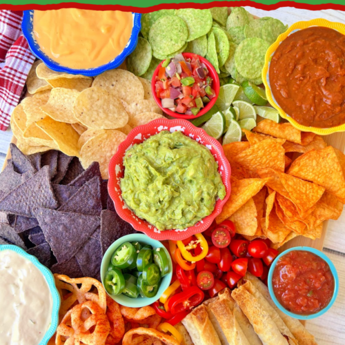 Mexican charcuterie board with zesty dips, crunchy chips and tasty Mexican bites make this perfect for any party!