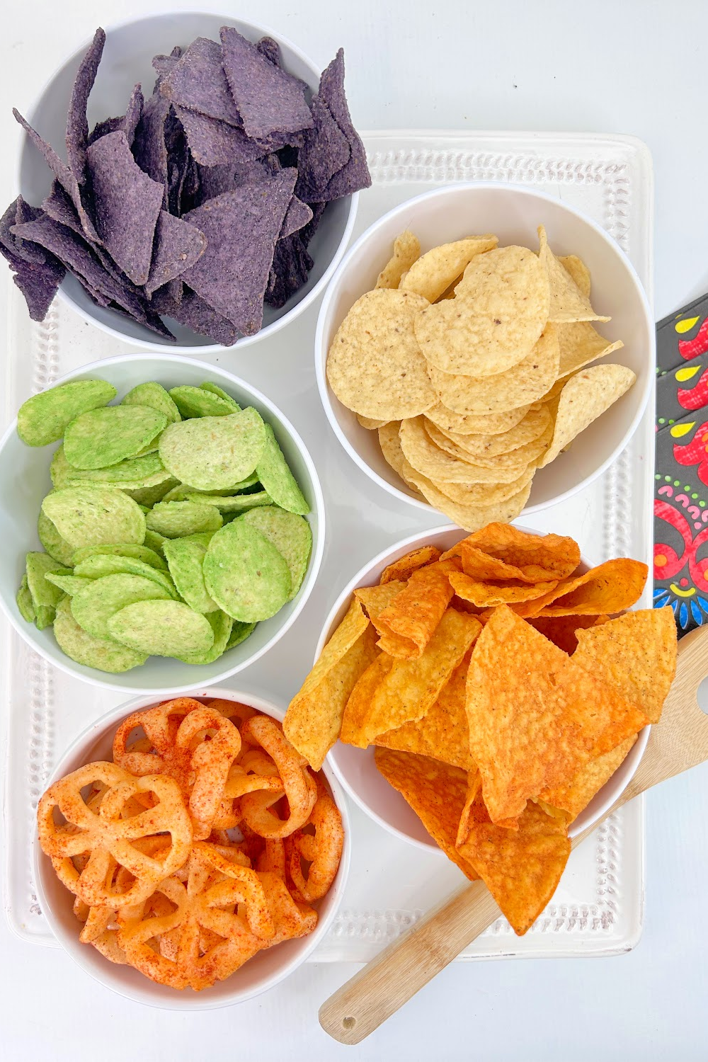 Small bowls of corn tortilla chips for salsas and Mexican dips.
