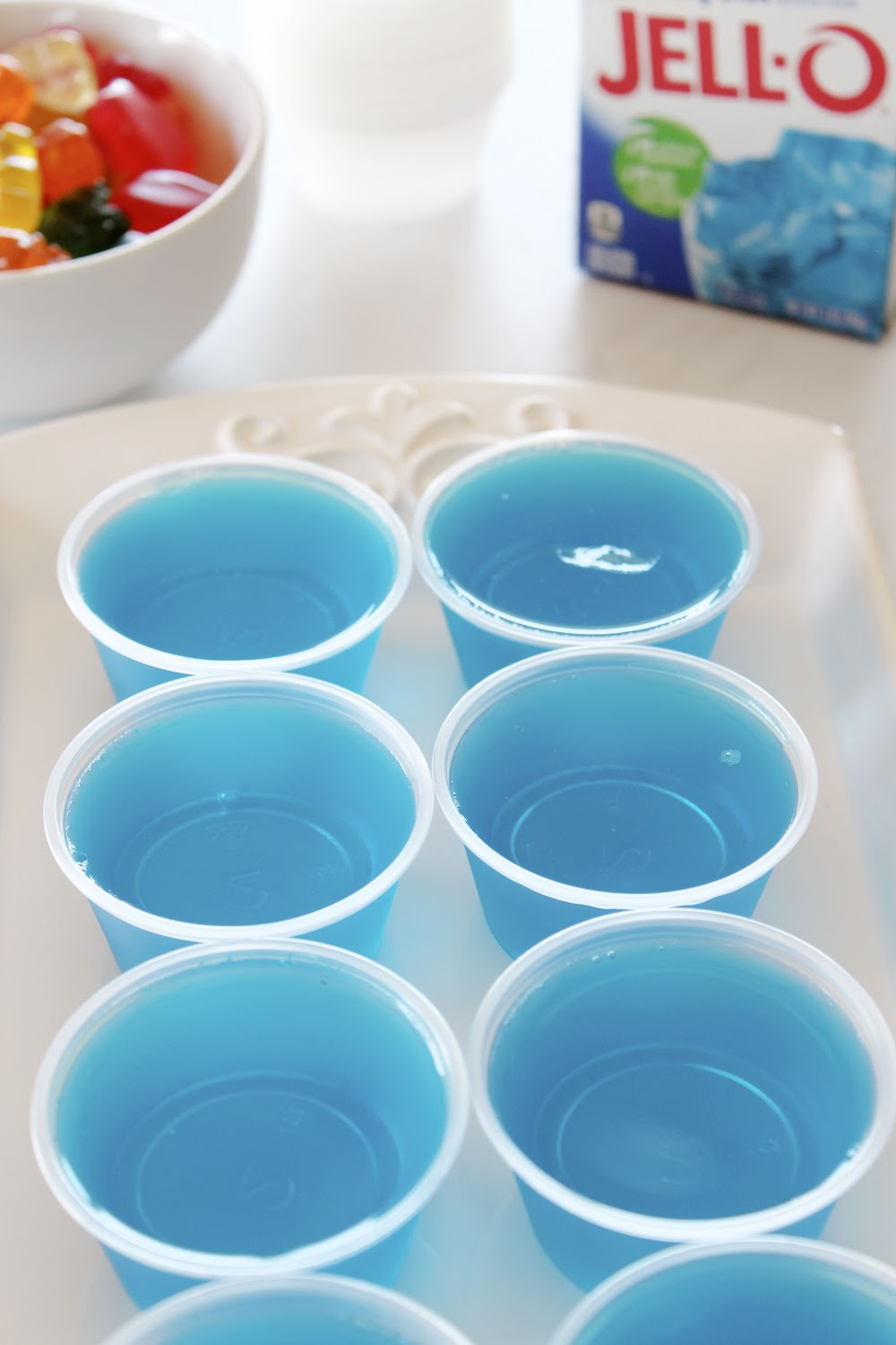Line the small cups up in a row and fill with jello mixture. Then refrigerate.