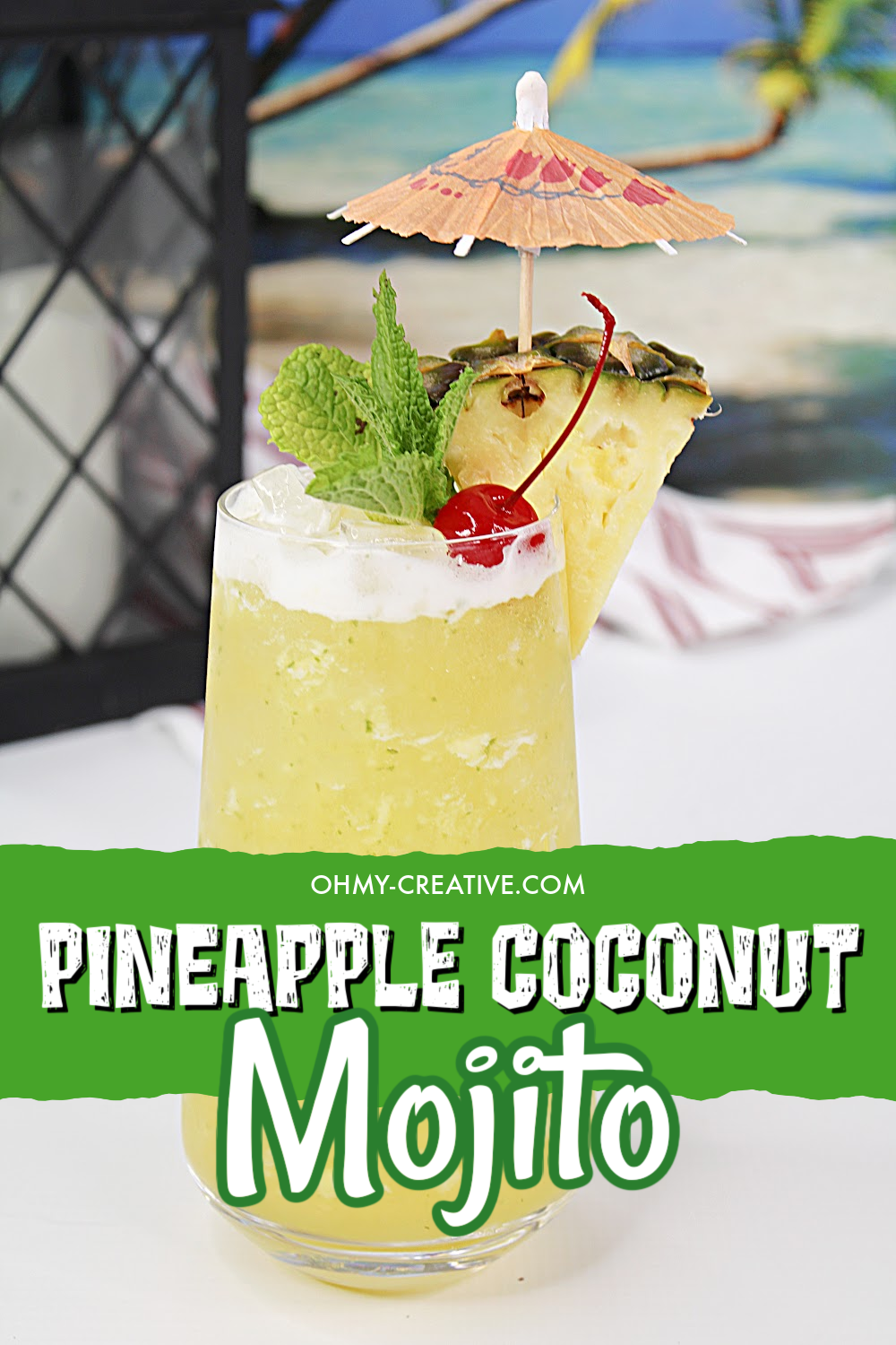 A tall glass of pineapple coconut mojito with all the flavors of the tropics! Garnished with a wedge of pineapple, maraschino cherry and an umbrella.