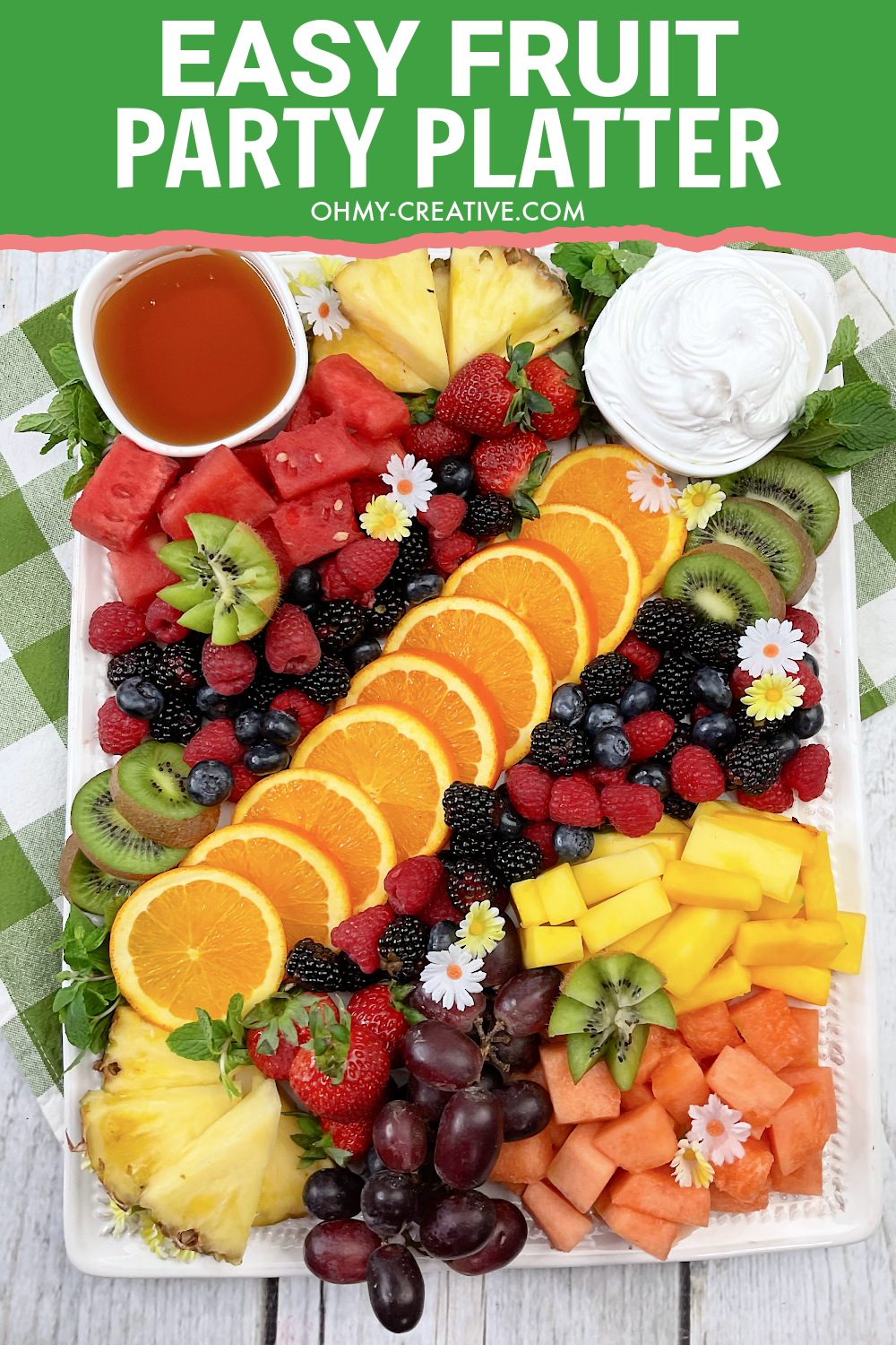 Easy Fruit Party Platter with oranges, berries, kiwi, pineapple and more.