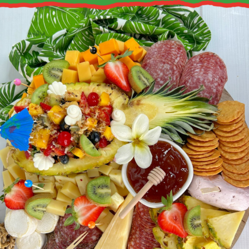 Tropical luau charcuterie board with a fresh pineapple salad.