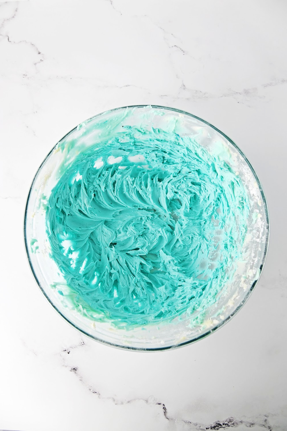 bowl of light blue icing