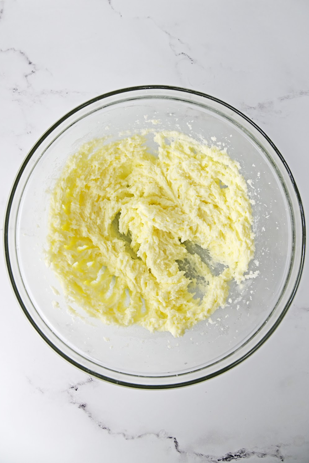 bowl of butter mixed in a mixing bowl