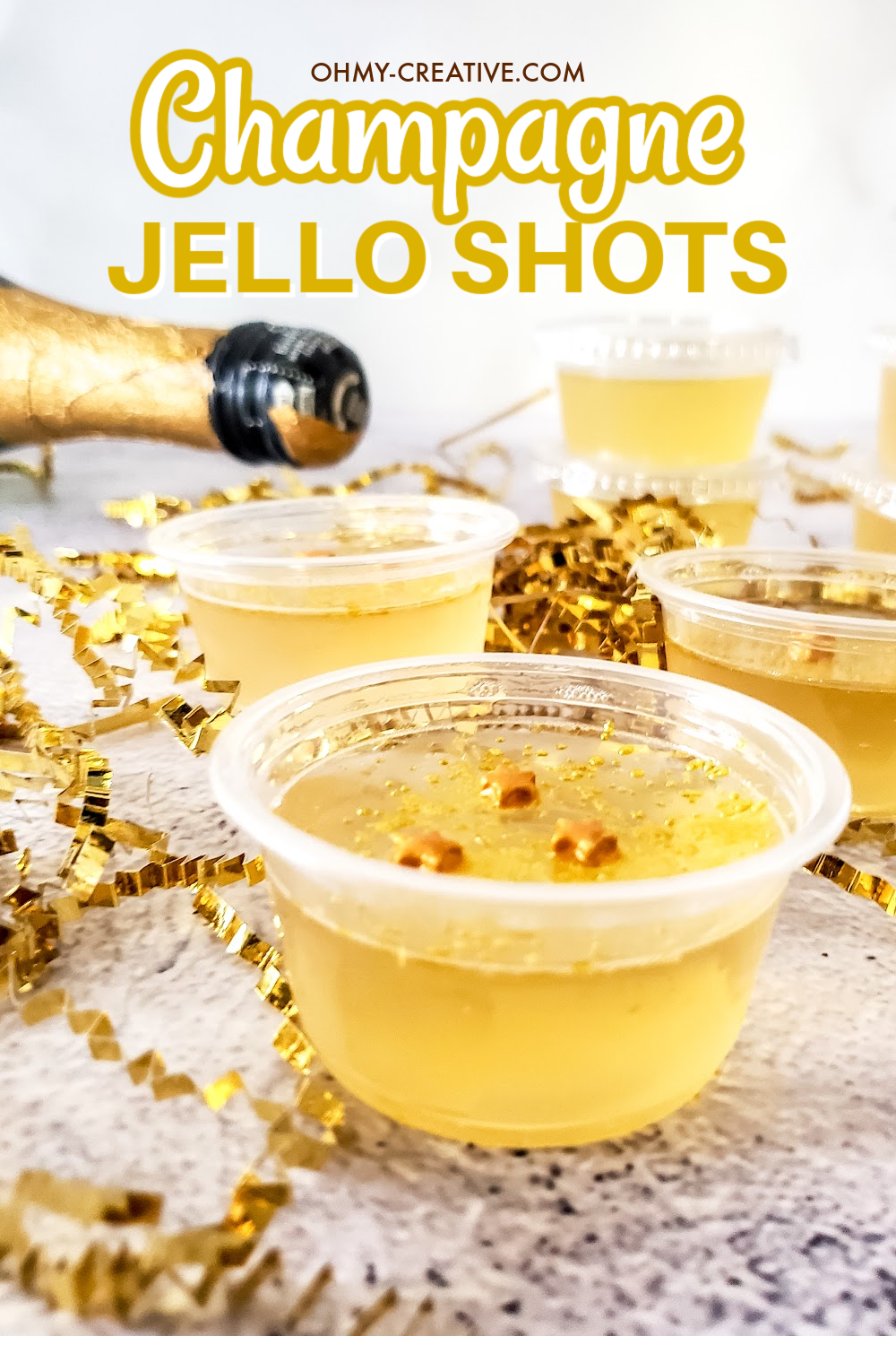 Champagne Jello Shots with a champagne bottle in the background